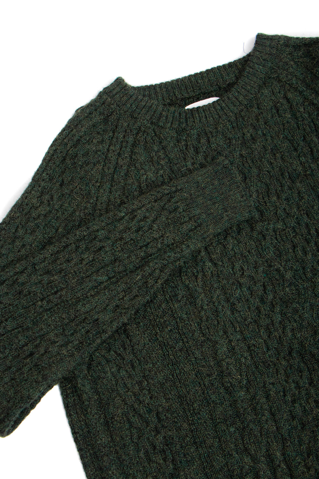 Dark green cable knit sweater on a white background #colour_pine