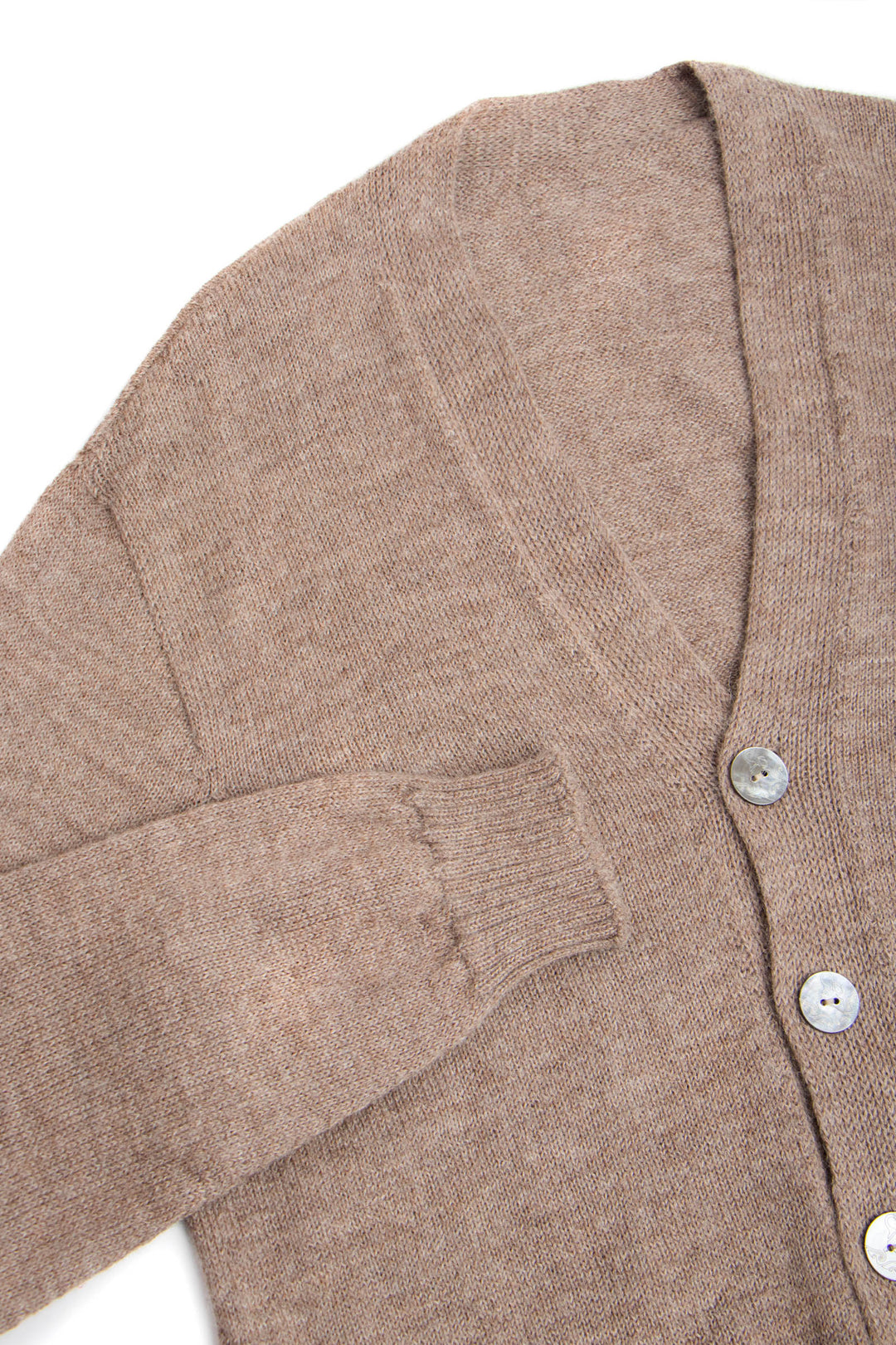 Close-up of a brown cardigan with buttons on a white background #colour_fawn