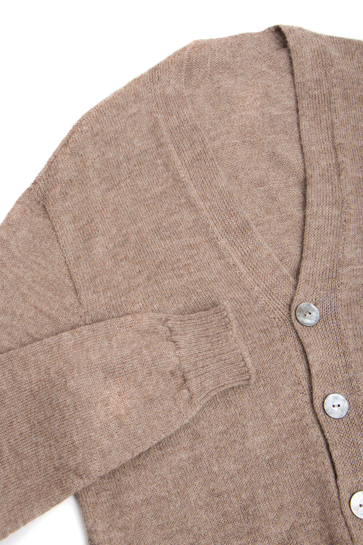 Close-up of a brown cardigan with buttons on a white background #colour_fawn