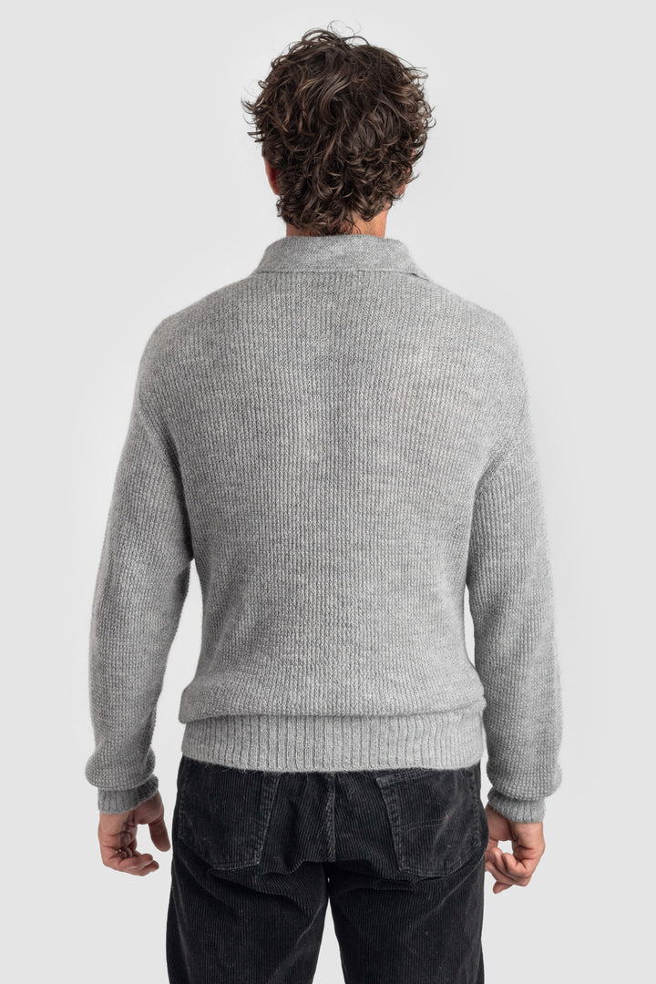 Person wearing a gray sweater on a white background #colour_cool-grey